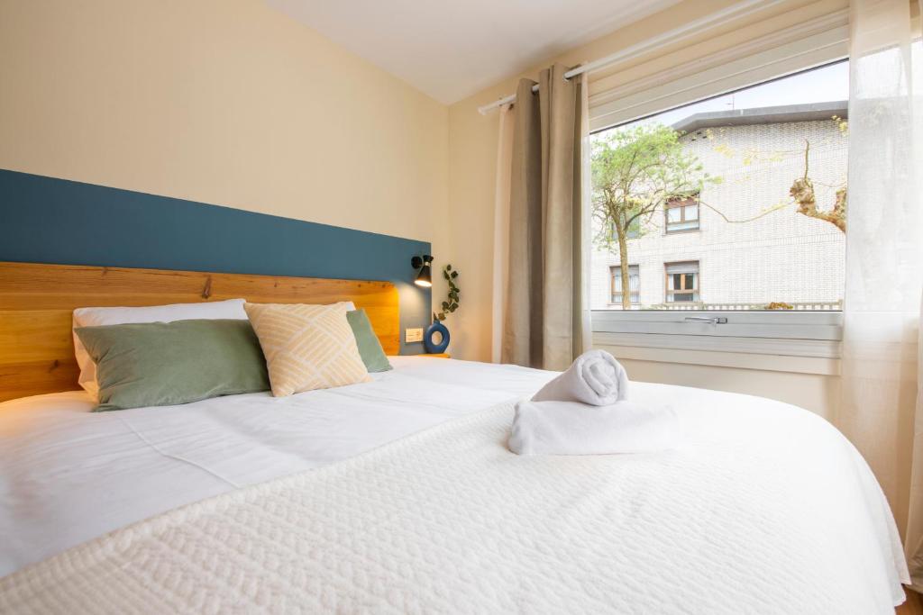 Postel nebo postele na pokoji v ubytování Hotel Donosti