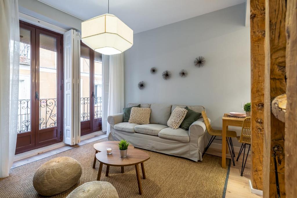 a living room with a couch and a table at 2 bedrooms 2 bathrooms furnished - Las Letras - Modern - MintyStay in Madrid