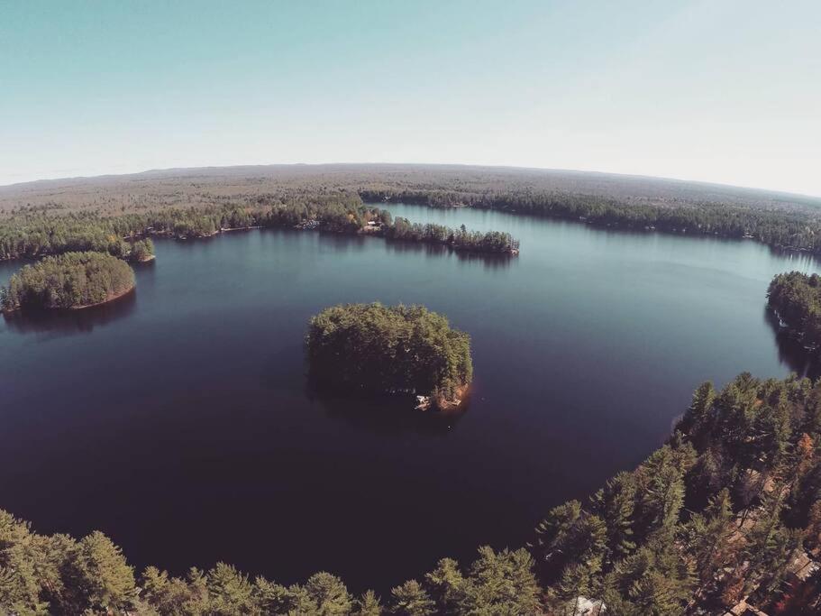 an island in the middle of a large lake at Grant Island Waterfront Cottage Brantingham Lk - Dogs Love - Worlds Raddest Island in Glenfield