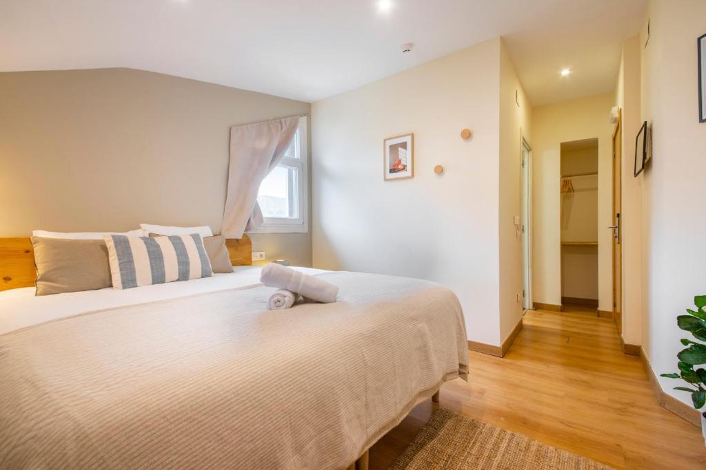 Postel nebo postele na pokoji v ubytování Hotel Donosti
