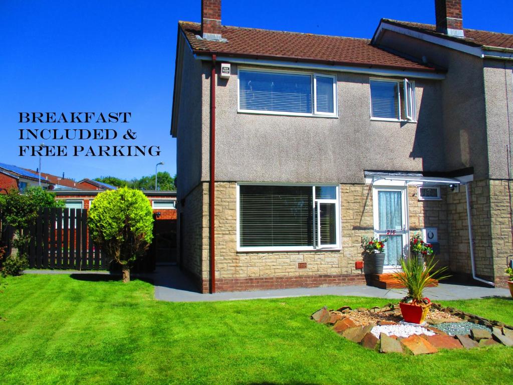 a house with a sign on the side of it at SUPER SINGLE ROOM in Cardiff