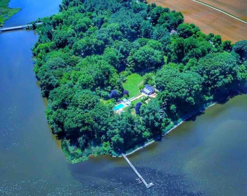 an island in the water with a house on it at Blake House Historic Estate with Private Inn in Centreville