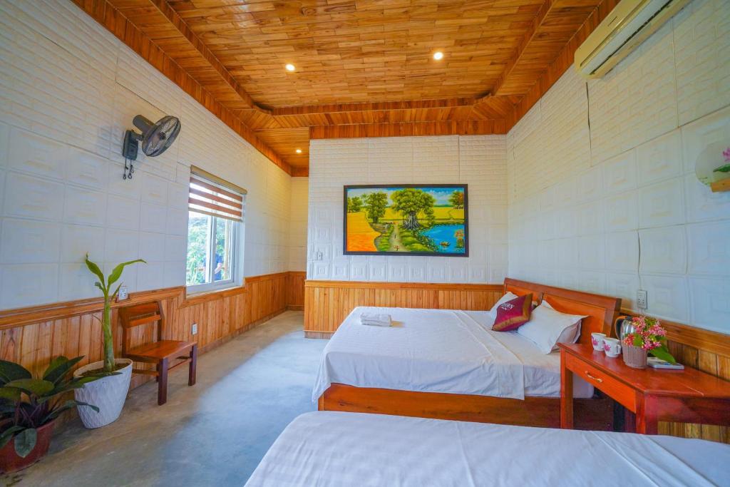 Postel nebo postele na pokoji v ubytování Phong Nha Dawn Home