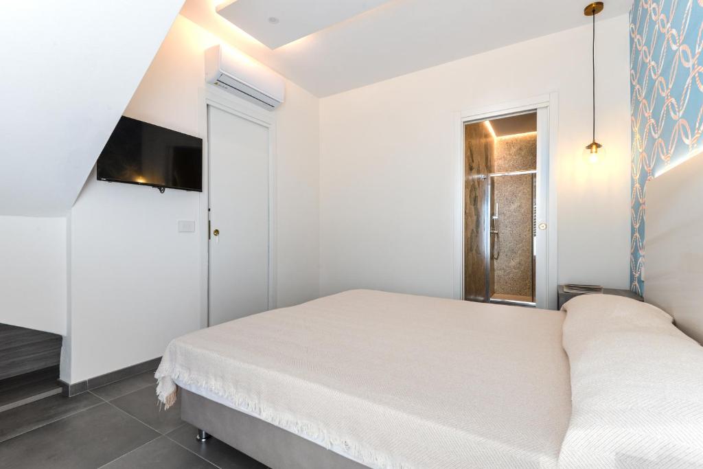 Posteľ alebo postele v izbe v ubytovaní Villa Serena vista mare
