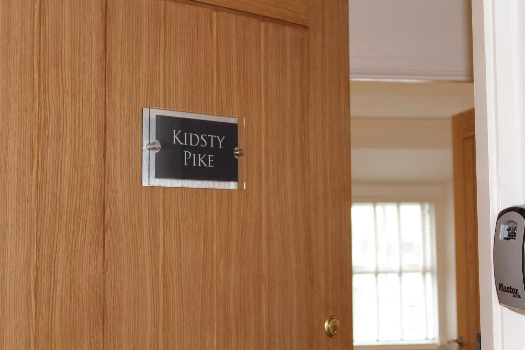 a sign on a door that reads knightspie at Kidsty Pike in Bowness-on-Windermere