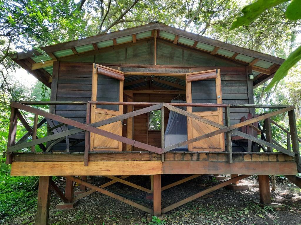 a tree house on a stand in the woods at Mombacho Lodge in Granada