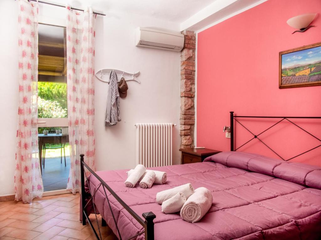 A bed or beds in a room at Agriturismo Al Girasole