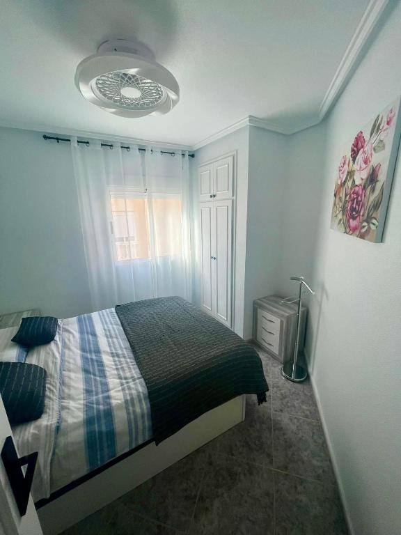 Postel nebo postele na pokoji v ubytování Capitan Friday Apartments