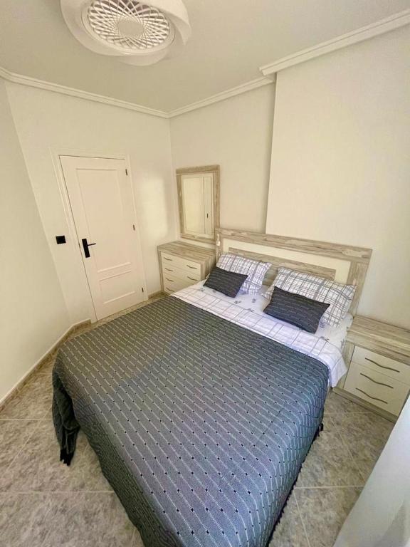 Postel nebo postele na pokoji v ubytování Capitan Friday Apartments