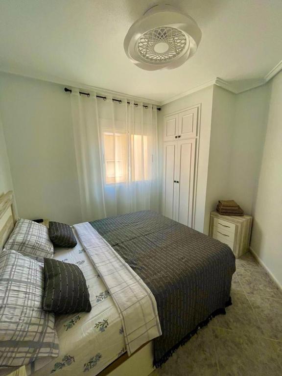 Postel nebo postele na pokoji v ubytování Capitan Friday Apartments
