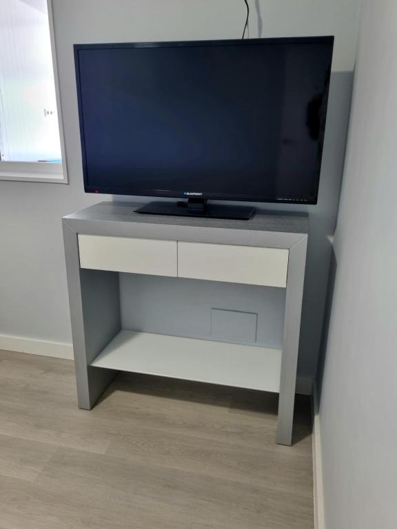 TV a/nebo společenská místnost v ubytování Casa Alcabre (Samil)