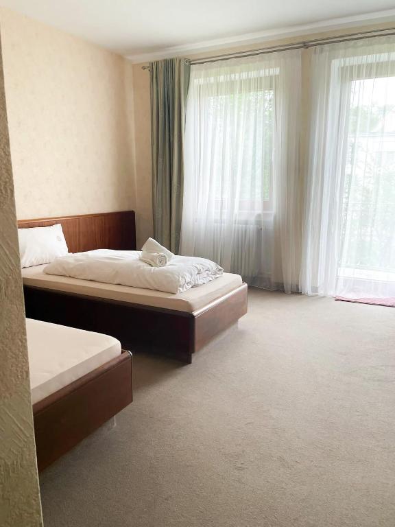 Postel nebo postele na pokoji v ubytování Hotel Garni Illertal