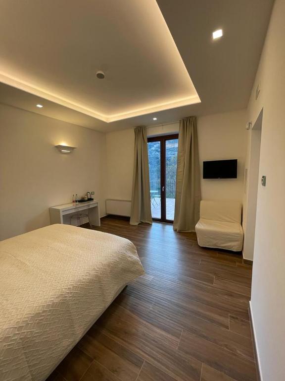 Łóżko lub łóżka w pokoju w obiekcie Maera B&B Ravello