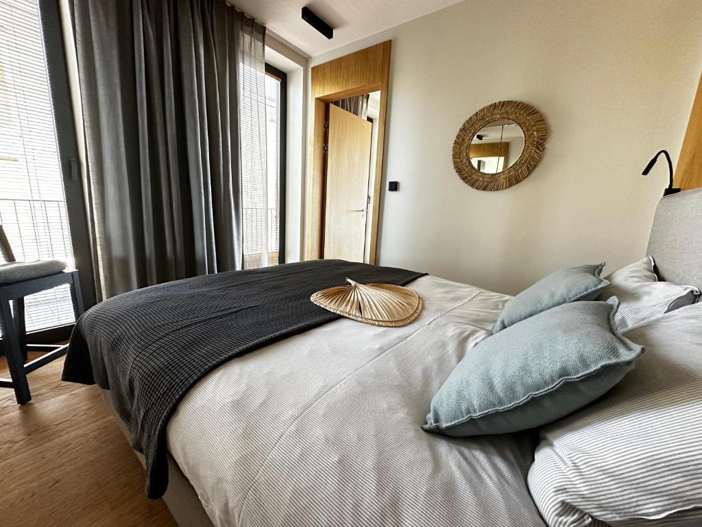 Postel nebo postele na pokoji v ubytování Apartamenty Nero