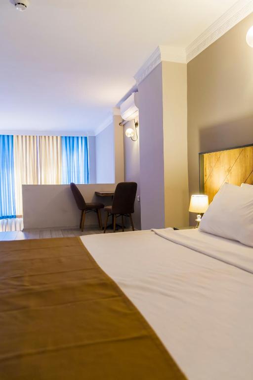 Postel nebo postele na pokoji v ubytování PRIVADO HOTELS