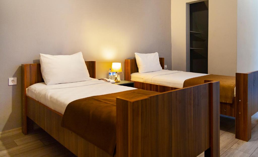 Postel nebo postele na pokoji v ubytování PRIVADO HOTELS