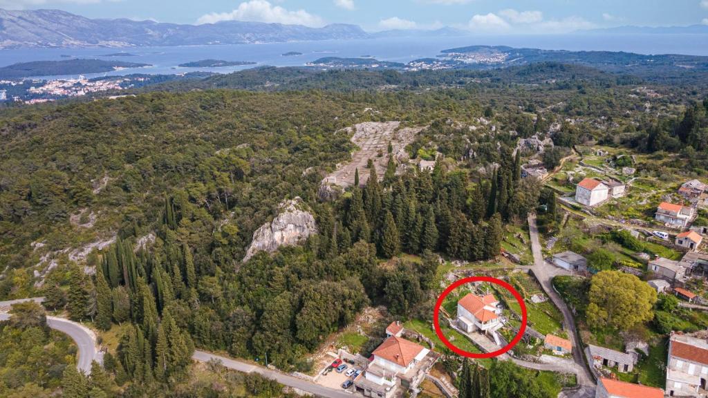 an aerial view of a house with a red at Holiday house with a parking space Zrnovo, Korcula - 21067 in Žrnovo