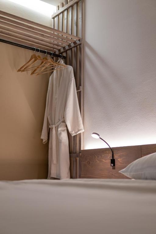 Postel nebo postele na pokoji v ubytování Bloom Suites
