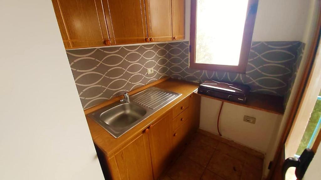 Third Room of Cozy Beachside Haven - Panoramic Radhime Retreat with Balcony Dining - Image 3