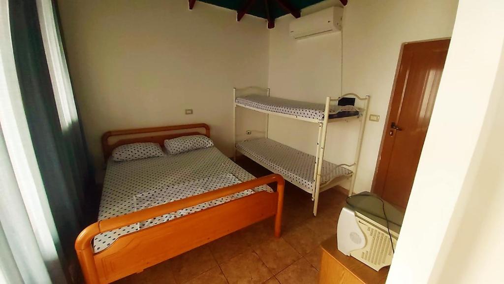 Third Room of Cozy Beachside Haven - Panoramic Radhime Retreat with Balcony Dining - Image 6