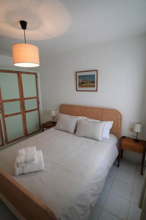 Postel nebo postele na pokoji v ubytování El Caleton Garden Apartment