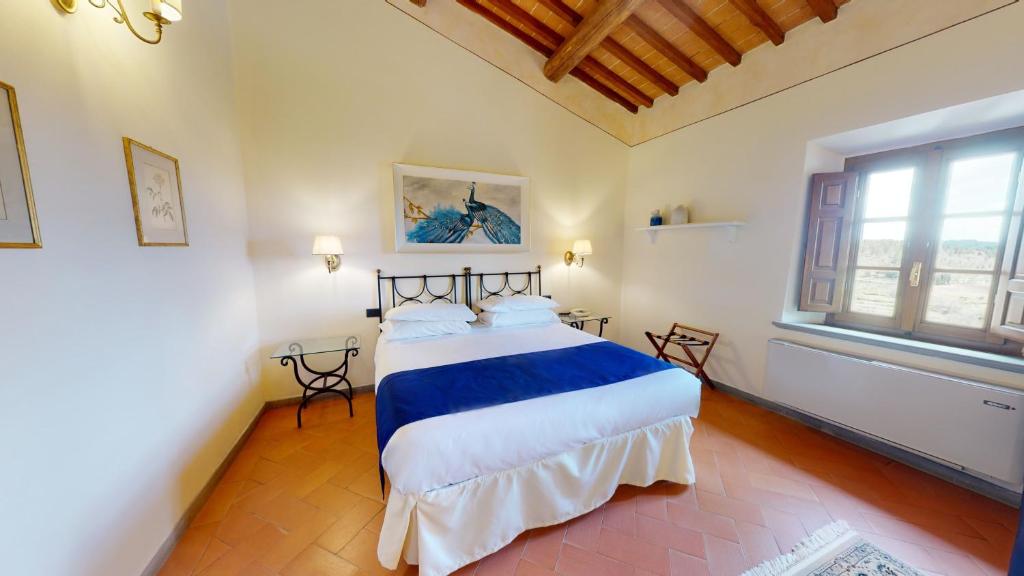 Postel nebo postele na pokoji v ubytování Hotel Palazzo Squarcialupi