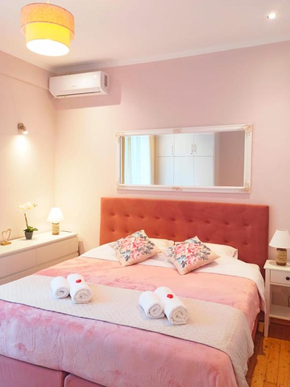 Postel nebo postele na pokoji v ubytování Elmar Apartment