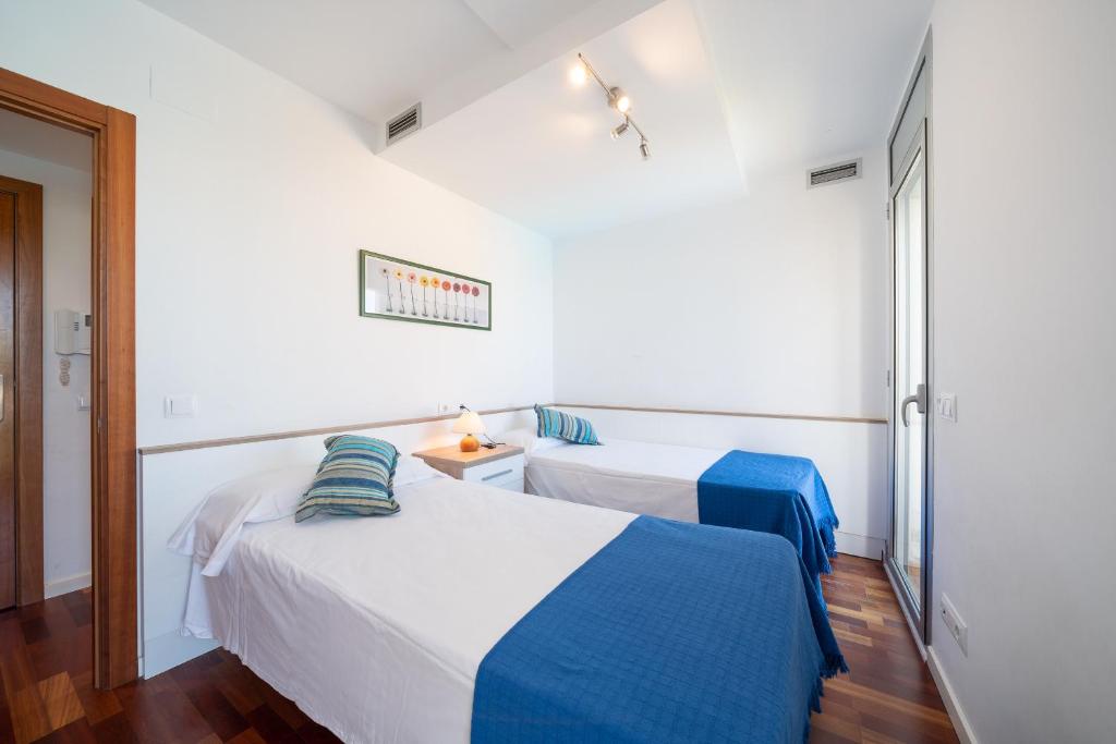 Posteľ alebo postele v izbe v ubytovaní Apartamento Luciana