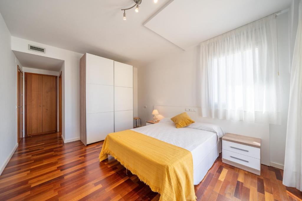 Posteľ alebo postele v izbe v ubytovaní Apartamento Luciana