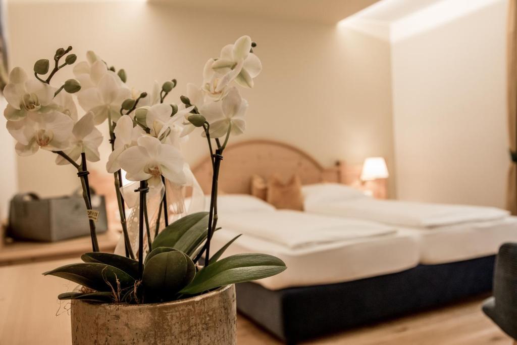 Postel nebo postele na pokoji v ubytování Hotel Gruber