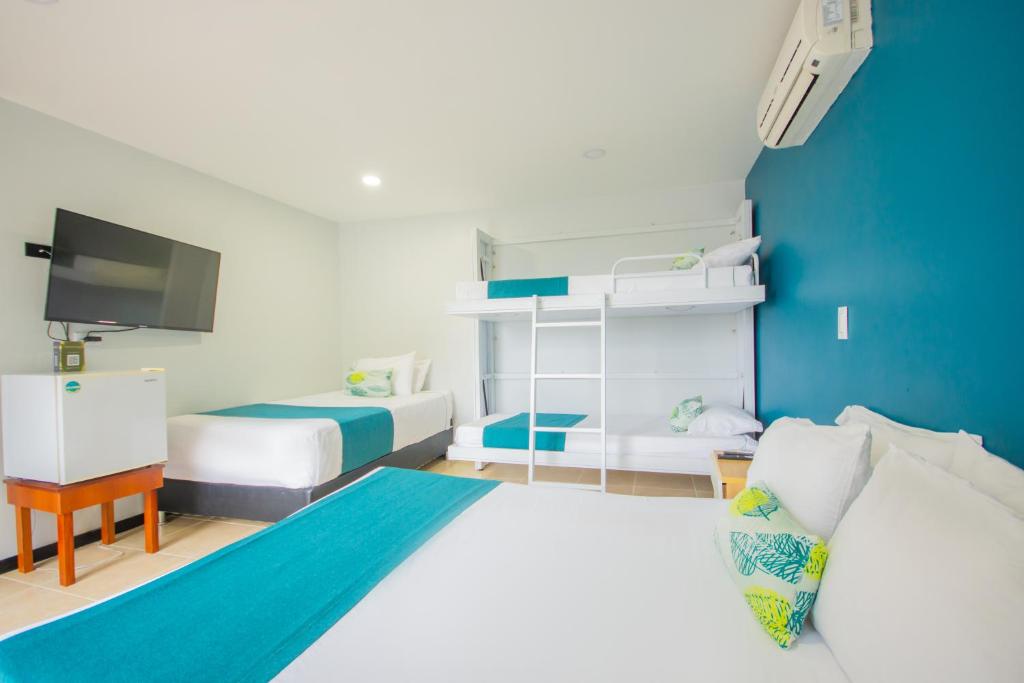 Postel nebo postele na pokoji v ubytování Greenview Medellin By St Hoteles