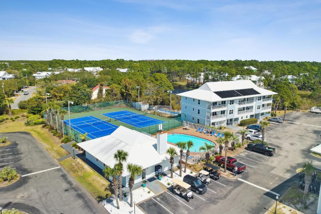 an aerial view of a tennis court and a building at Beachside Villas by Panhandle Getaways in Seagrove Beach