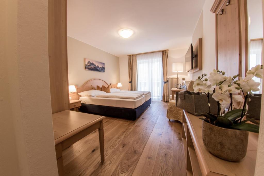 Postel nebo postele na pokoji v ubytování Hotel Gruber