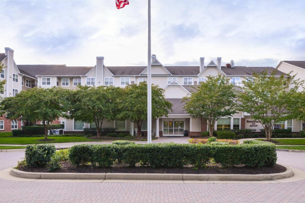 a building with a flag in front of it at Residence Inn Baltimore White Marsh in Baltimore