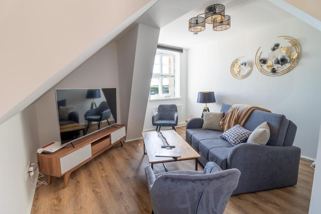TV a/nebo společenská místnost v ubytování Daniels Apartment an der Schloßbrücke