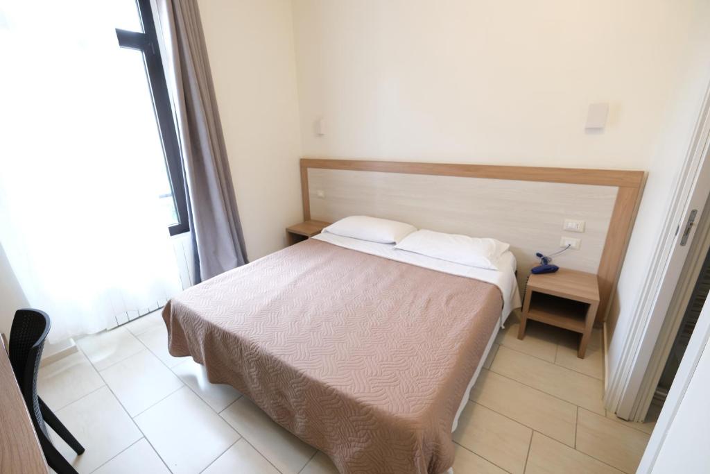 Postel nebo postele na pokoji v ubytování Hotel 26