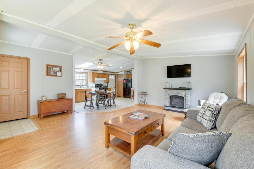 a living room with a couch and a table at Near Waterville Cozy Midcoast Vacation Rental! in Albion