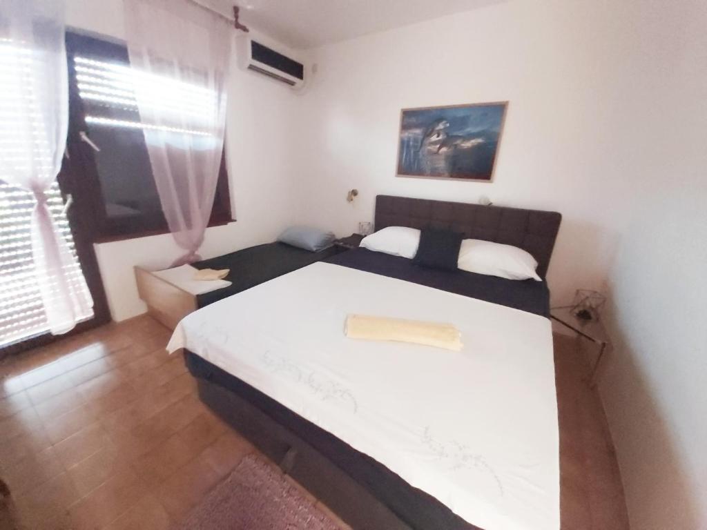 Postel nebo postele na pokoji v ubytování Apartman Arija-Pino