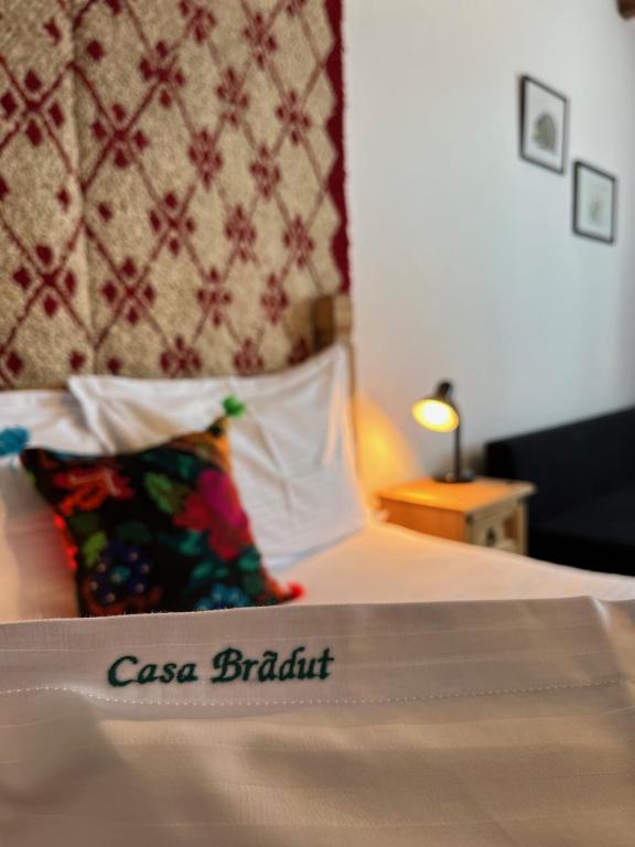 a close up of a bed in a hotel room at Casa Bradut in Dorna Arini