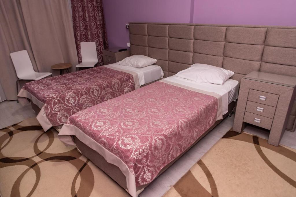 Postel nebo postele na pokoji v ubytování Hotel Gold