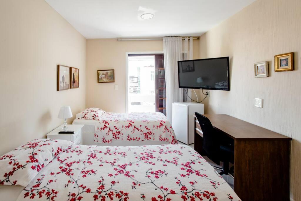 Кровать или кровати в номере Pousada Dona Clô