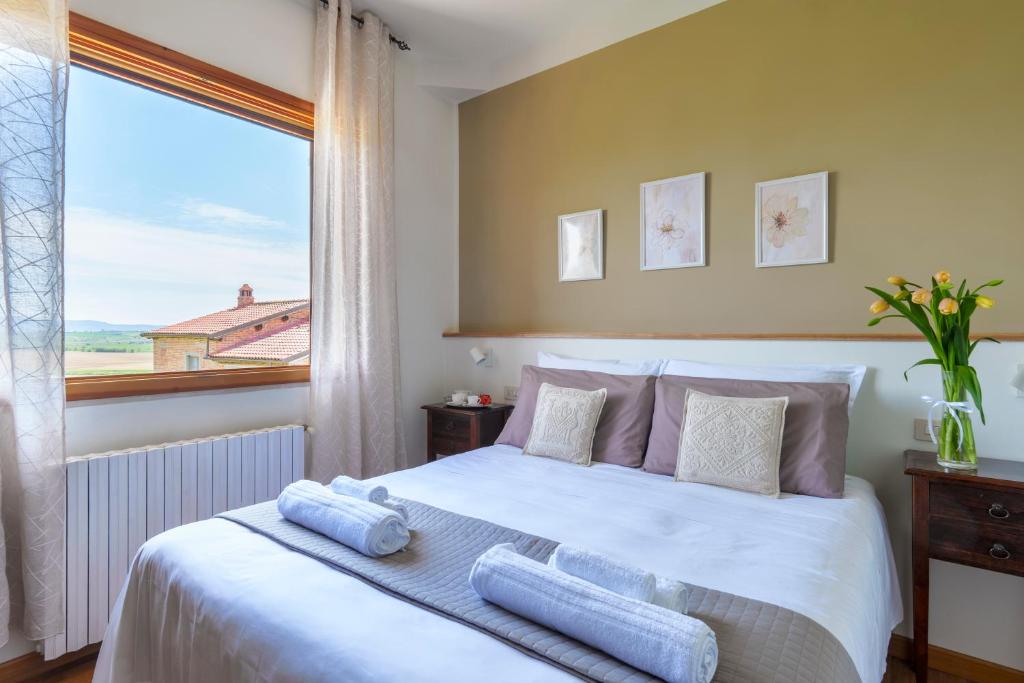 A bed or beds in a room at Agriturismo San Francesco
