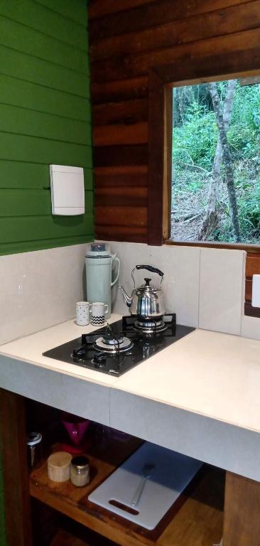 Kuchyň nebo kuchyňský kout v ubytování Cabanas sítio Ancestral