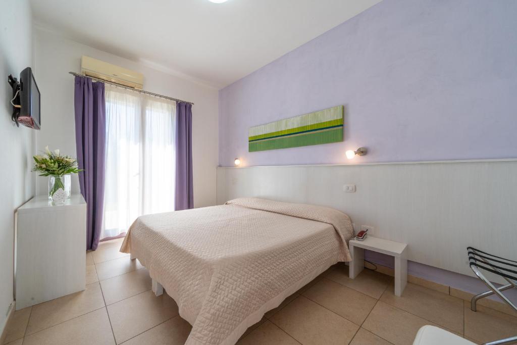TV a/nebo společenská místnost v ubytování Corte dei Melograni Hotel Resort