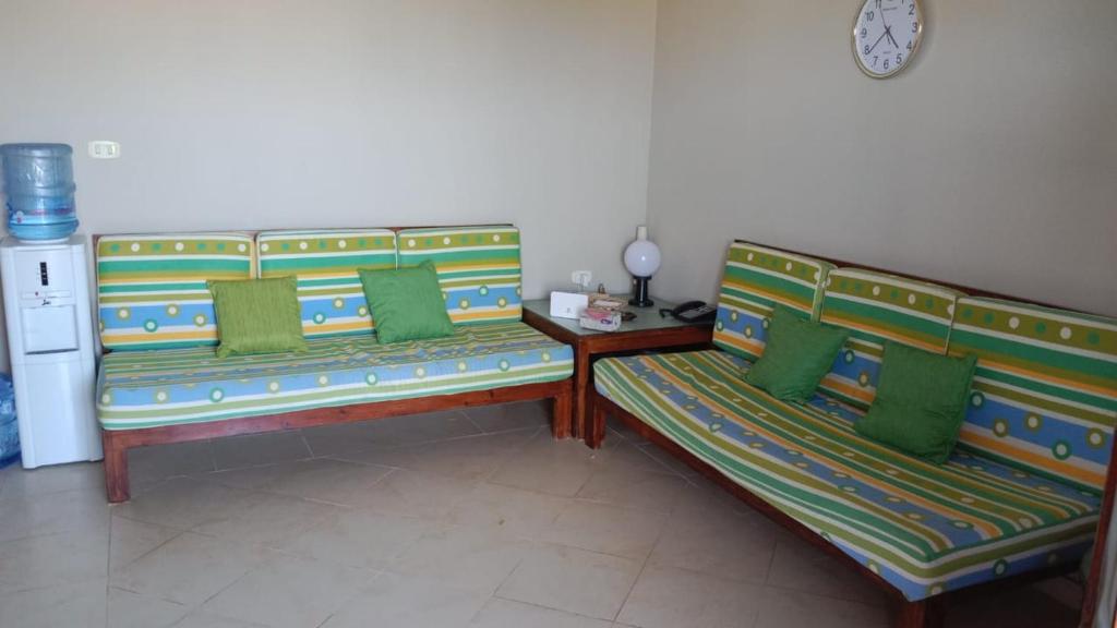 En eller flere senger på et rom på Coastal Escape - Ballah Resort