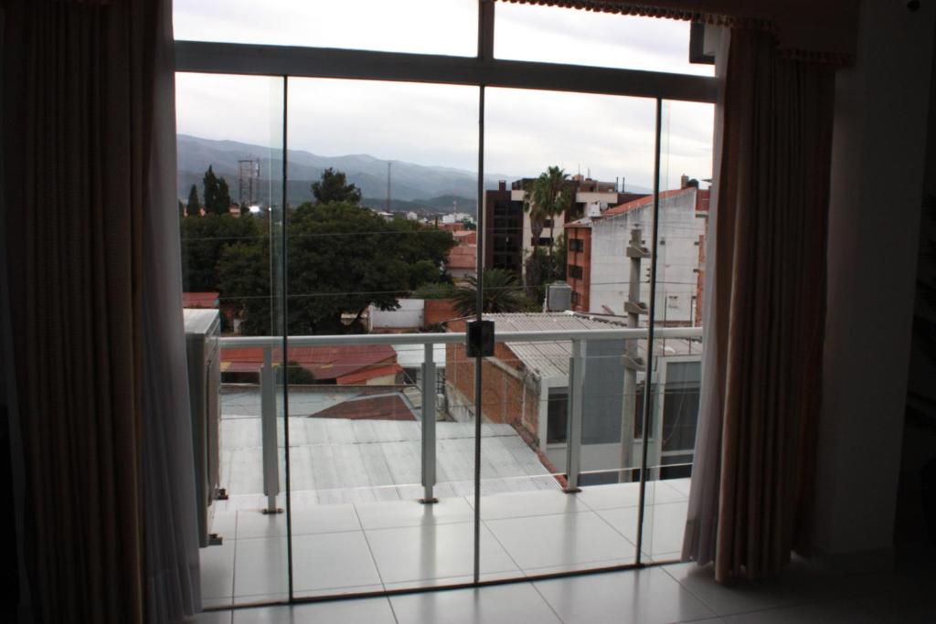 a large window with a view of a city at Moderno Departamento Céntrico c/ Wifi Empresarial in Tarija