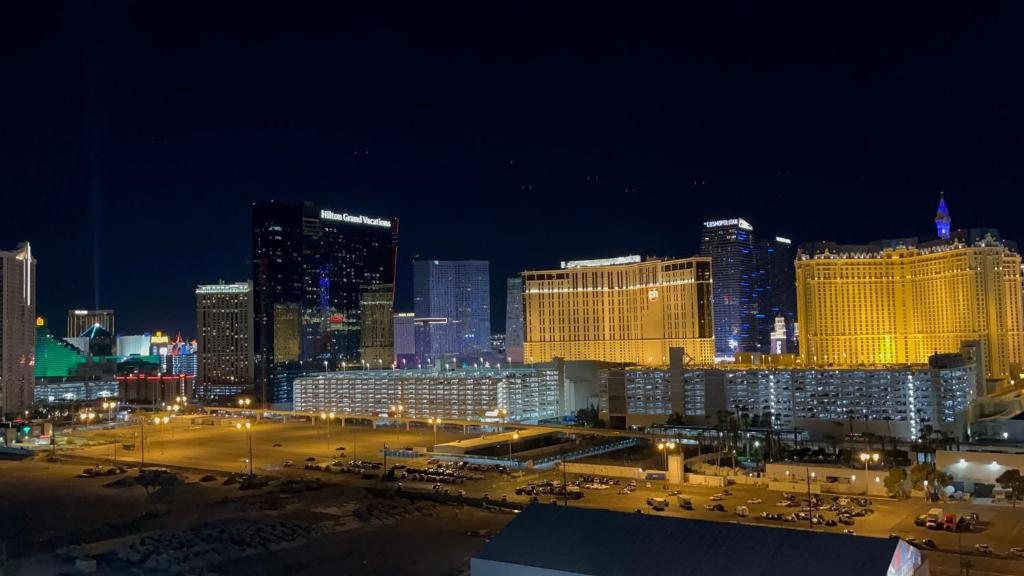 a view of a city at night with lights at Condo at Platinum Hotel Strip View in Las Vegas