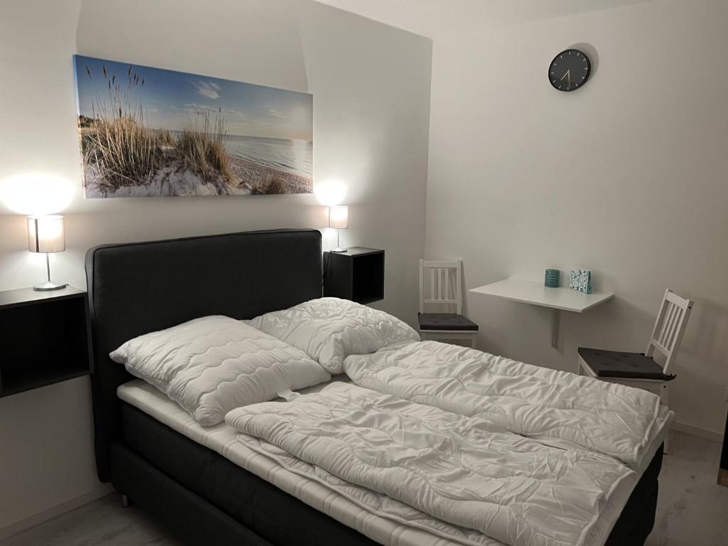 Postel nebo postele na pokoji v ubytování Mimi's Ostseeglück