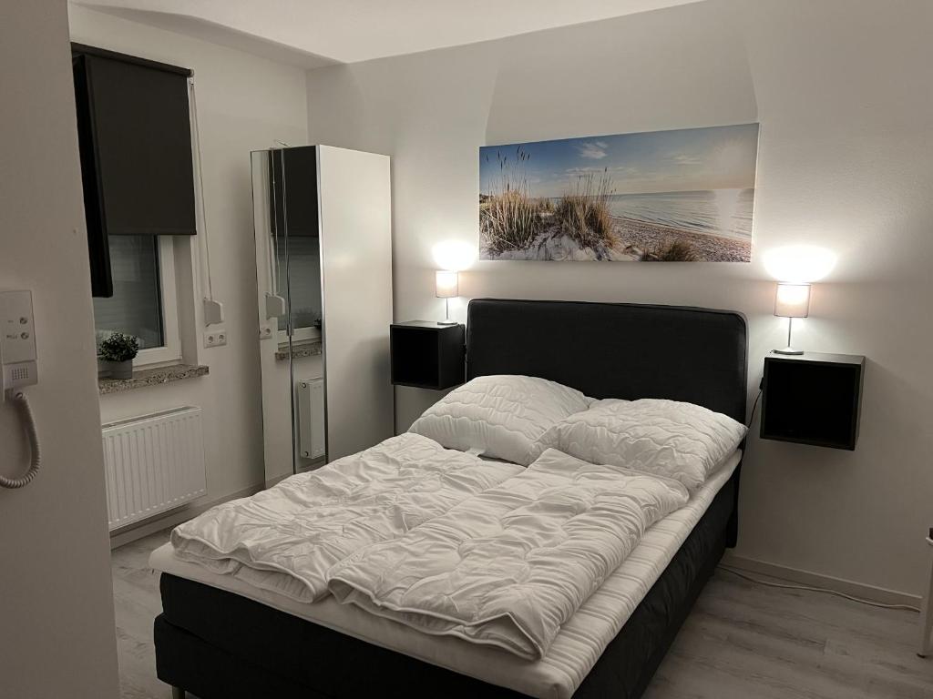 Postel nebo postele na pokoji v ubytování Mimi's Ostseeglück