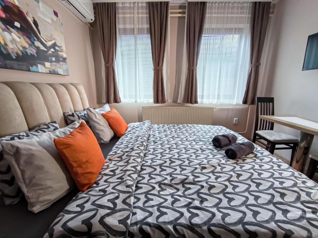 Postel nebo postele na pokoji v ubytování Studio Apartments Maksimović